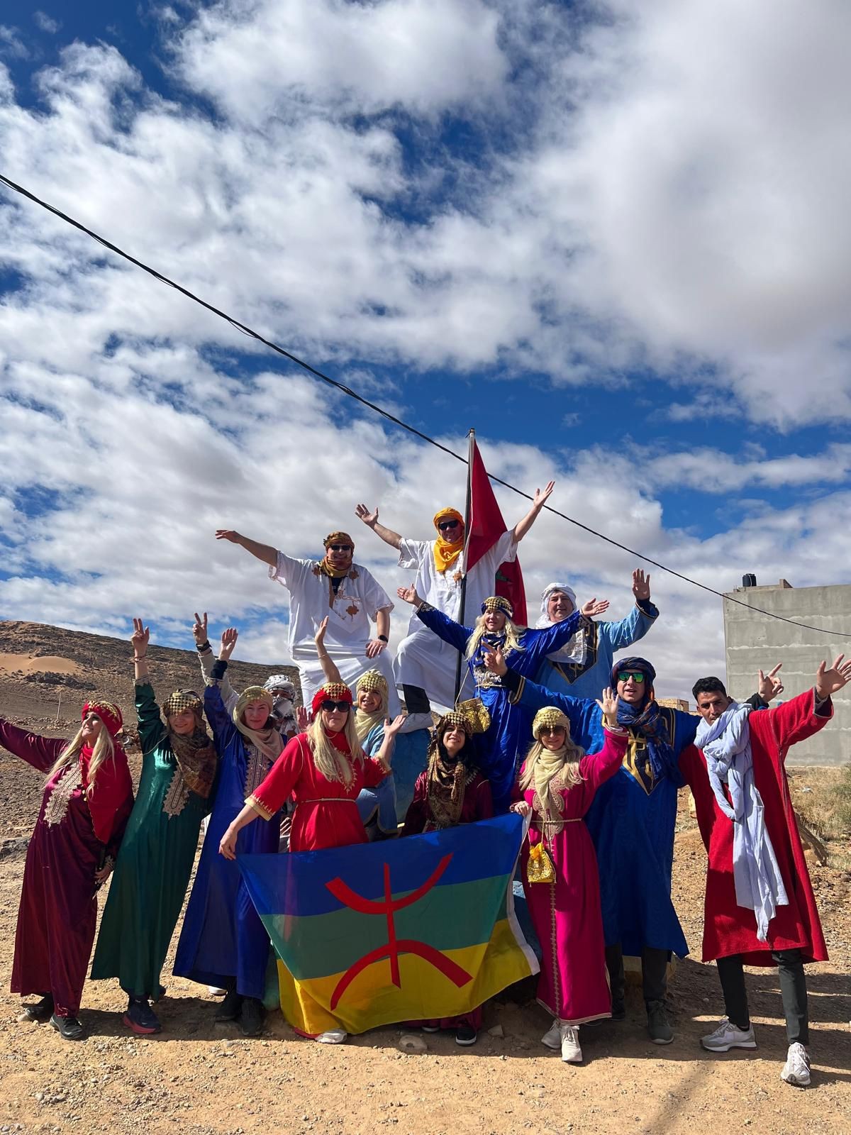 Travelers sharing a moment in Amazigh dress